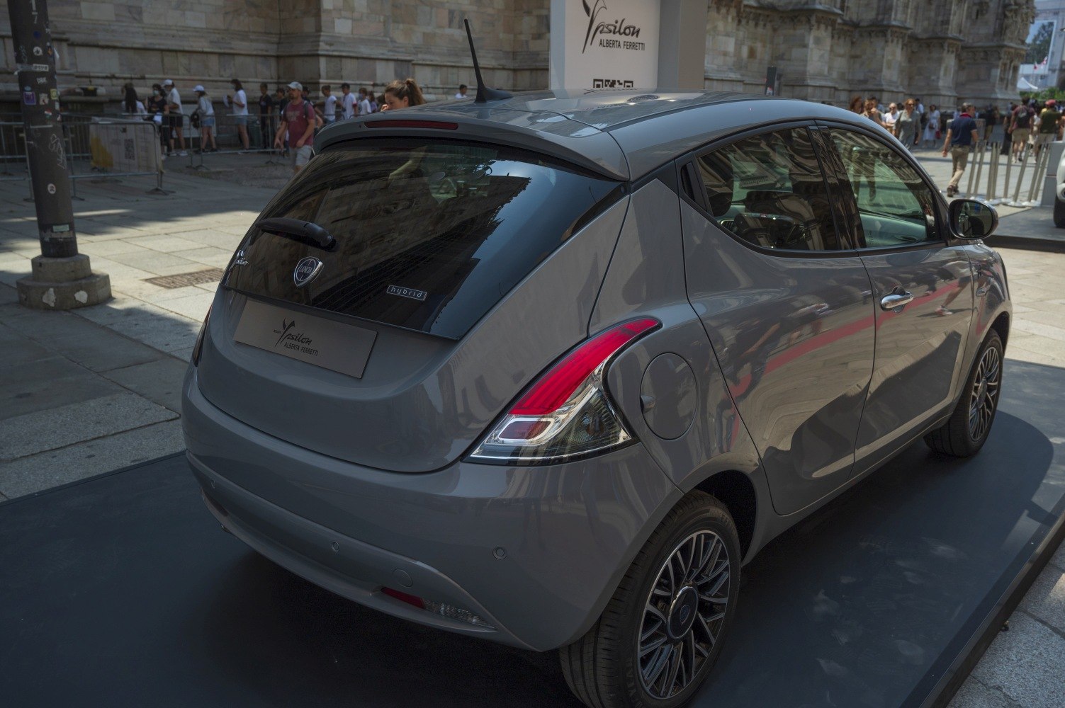 Compact hatchback rear with hybrid badge, taillights, alloy wheels