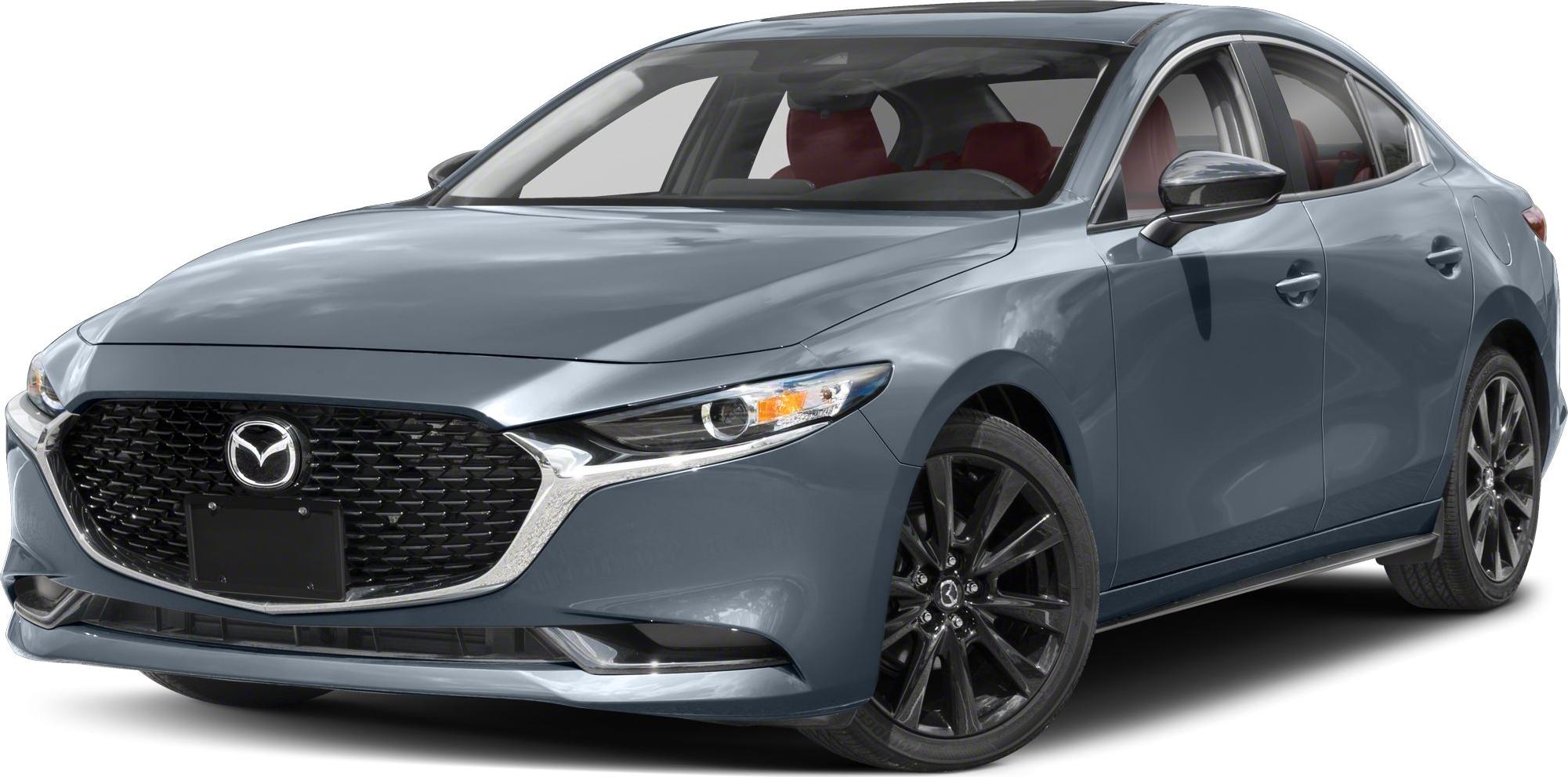 Front view of sedan with black mesh grill and black alloy wheels