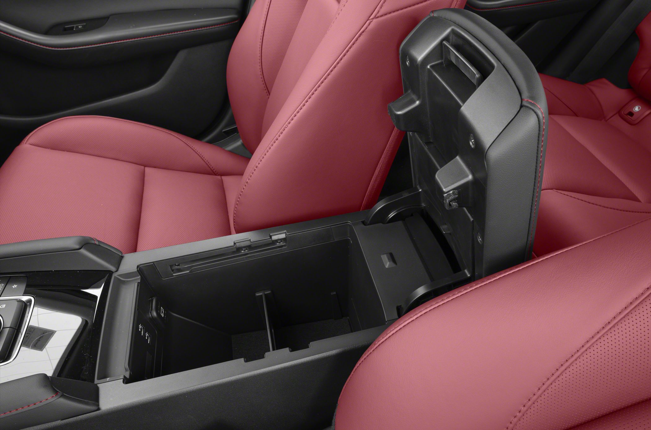 Center console storage with red leather seats