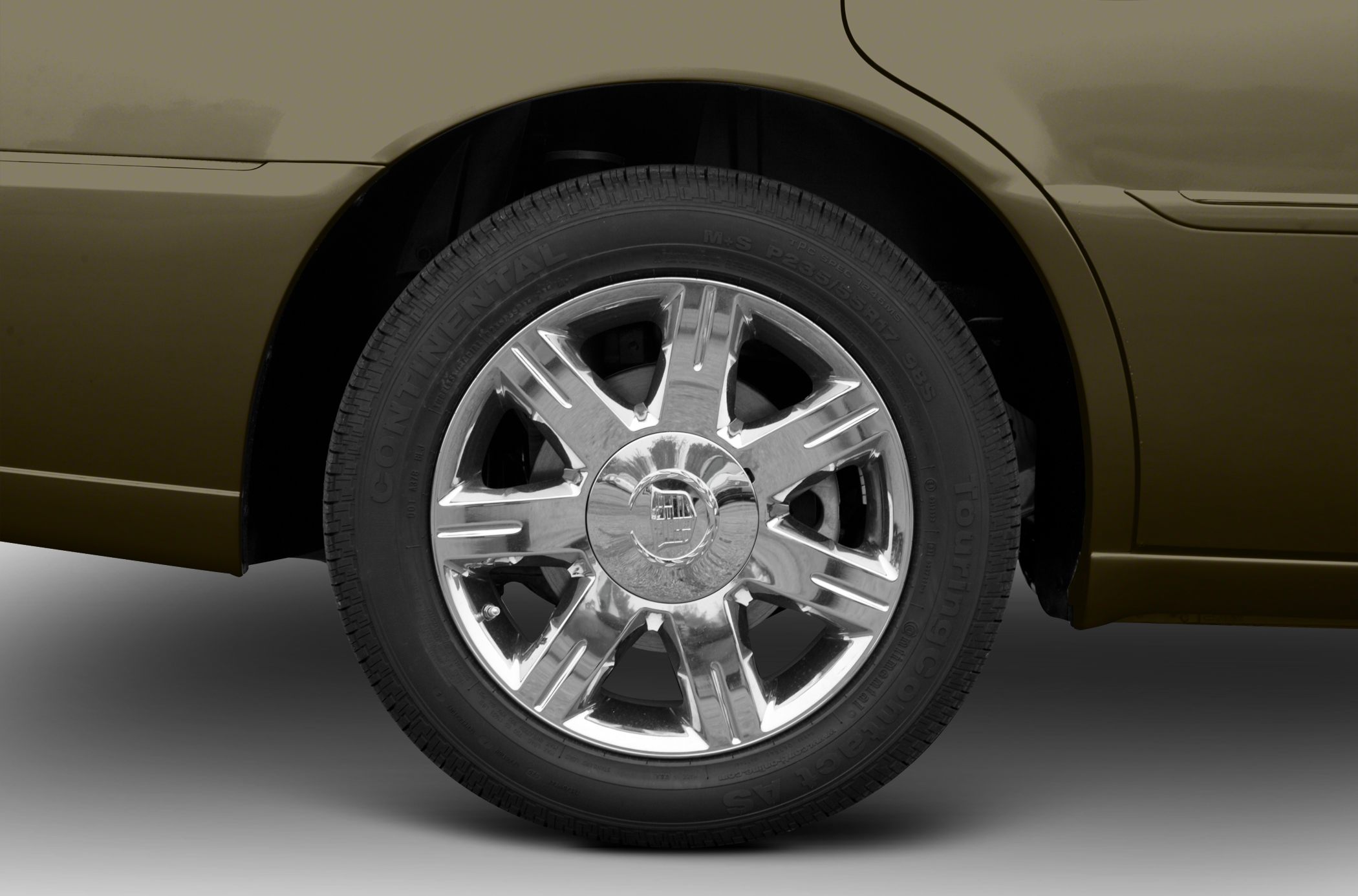 Chrome alloy wheel with Continental TouringContact tire on luxury sedan