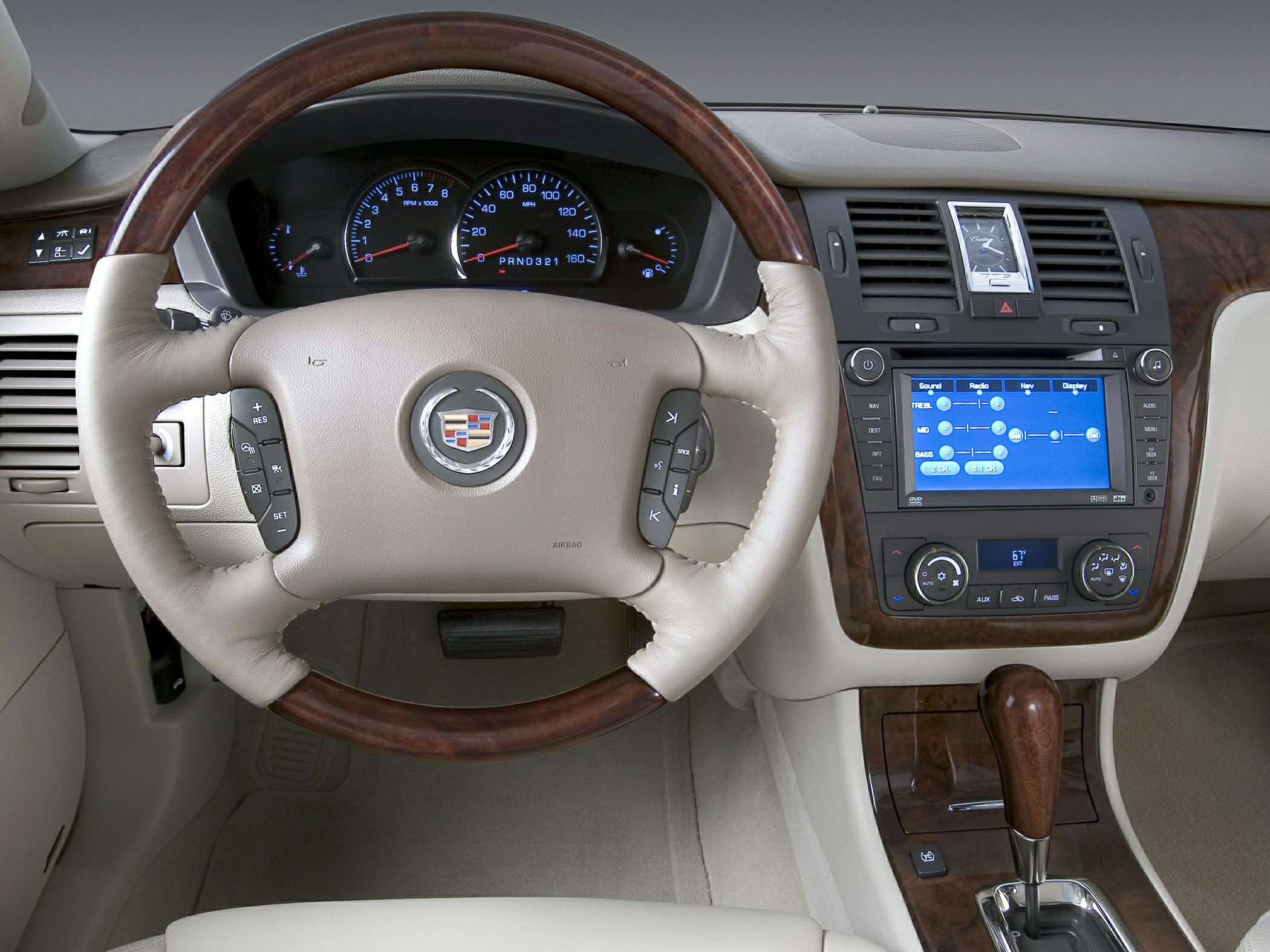 Leather and wood steering wheel with digital infotainment system and climate control