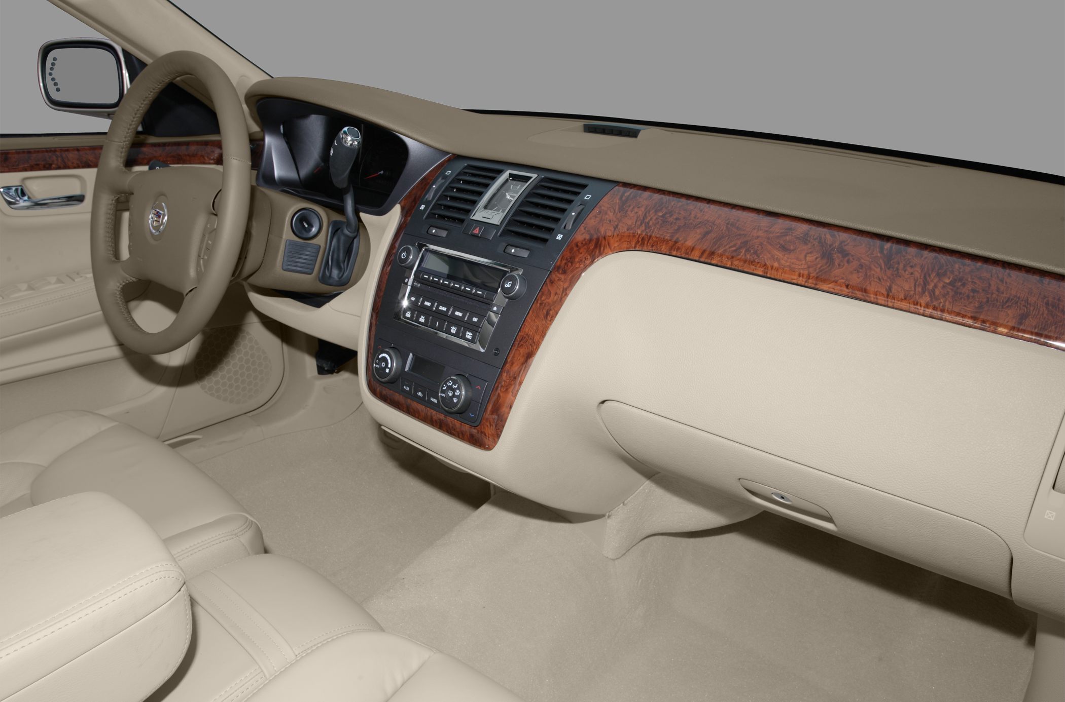 Beige leather interior with wood trim dashboard and steering wheel