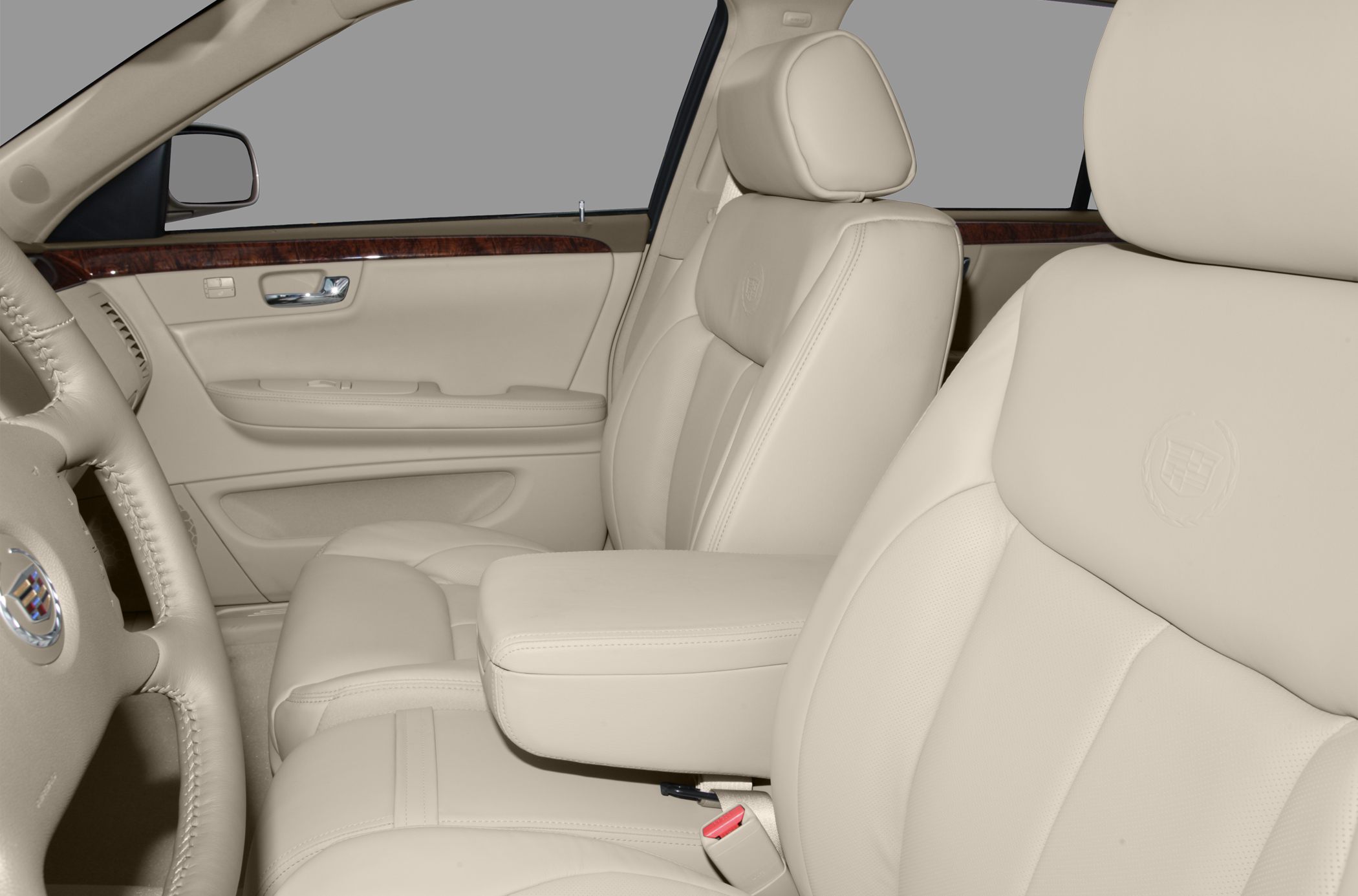 Beige leather seats with wood trim door panel in sedan interior