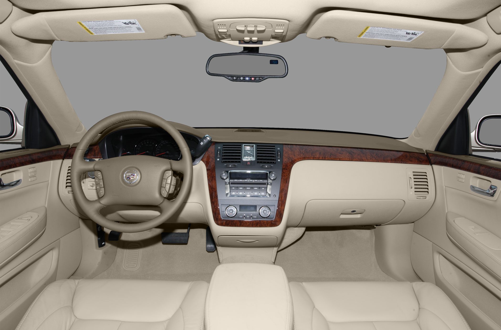 Leather steering wheel and wood-trimmed dashboard with center console controls