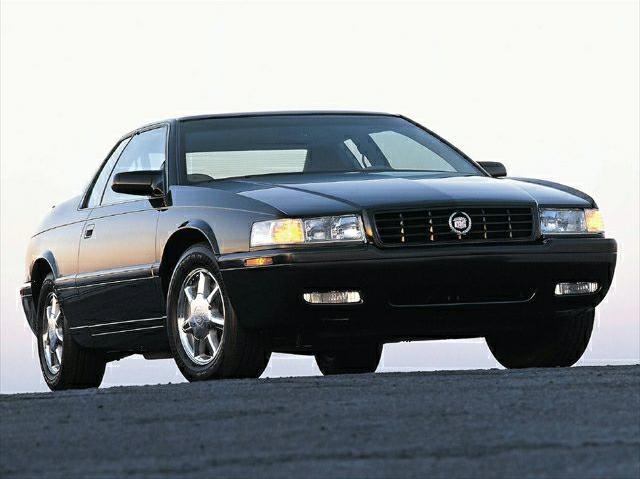 Front view with rectangular headlights and chrome wheels