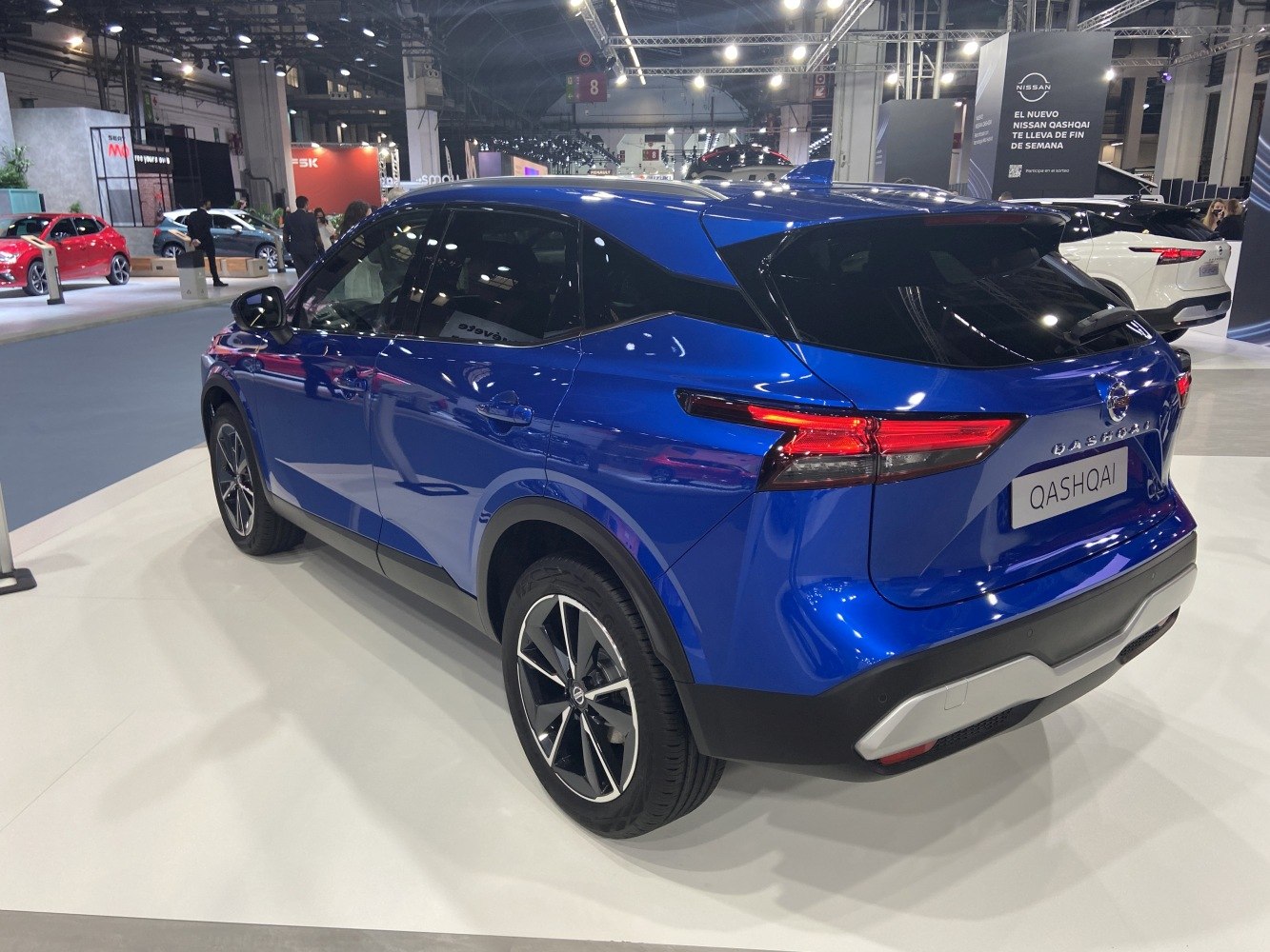 Rear and side view of a modern SUV with sharp taillights and sporty wheels