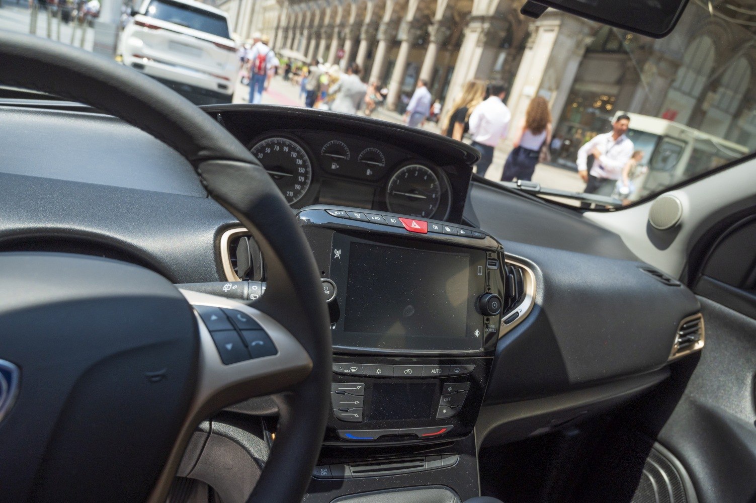 Dashboard with infotainment touchscreen and steering wheel control buttons