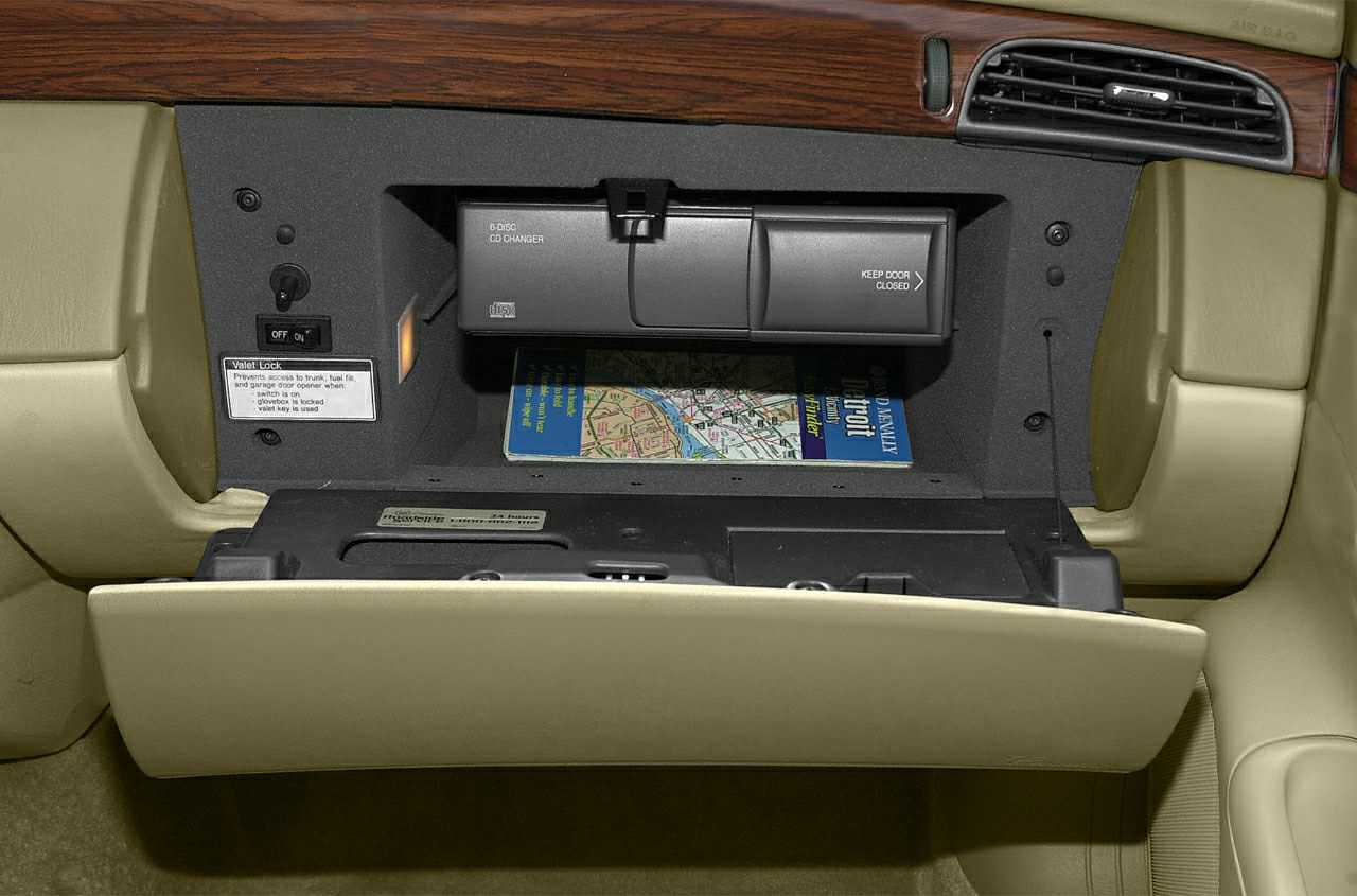 Glovebox with 6-disc CD changer and valet lock in beige interior