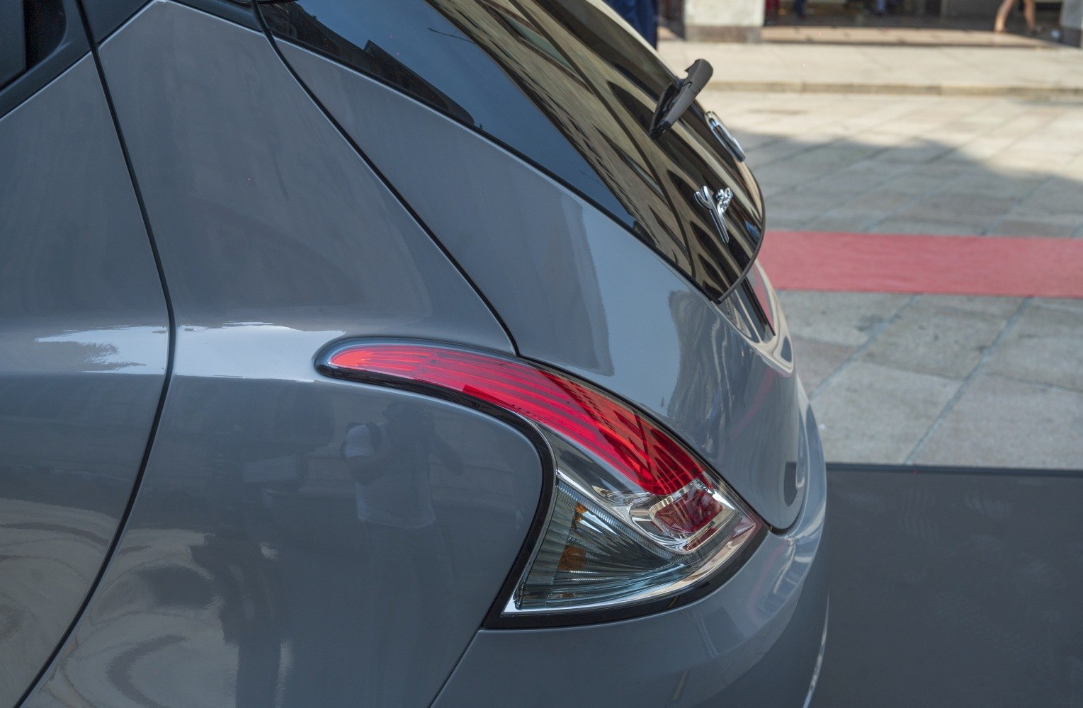 Close-up of a car rear light and tailgate curve in modern design