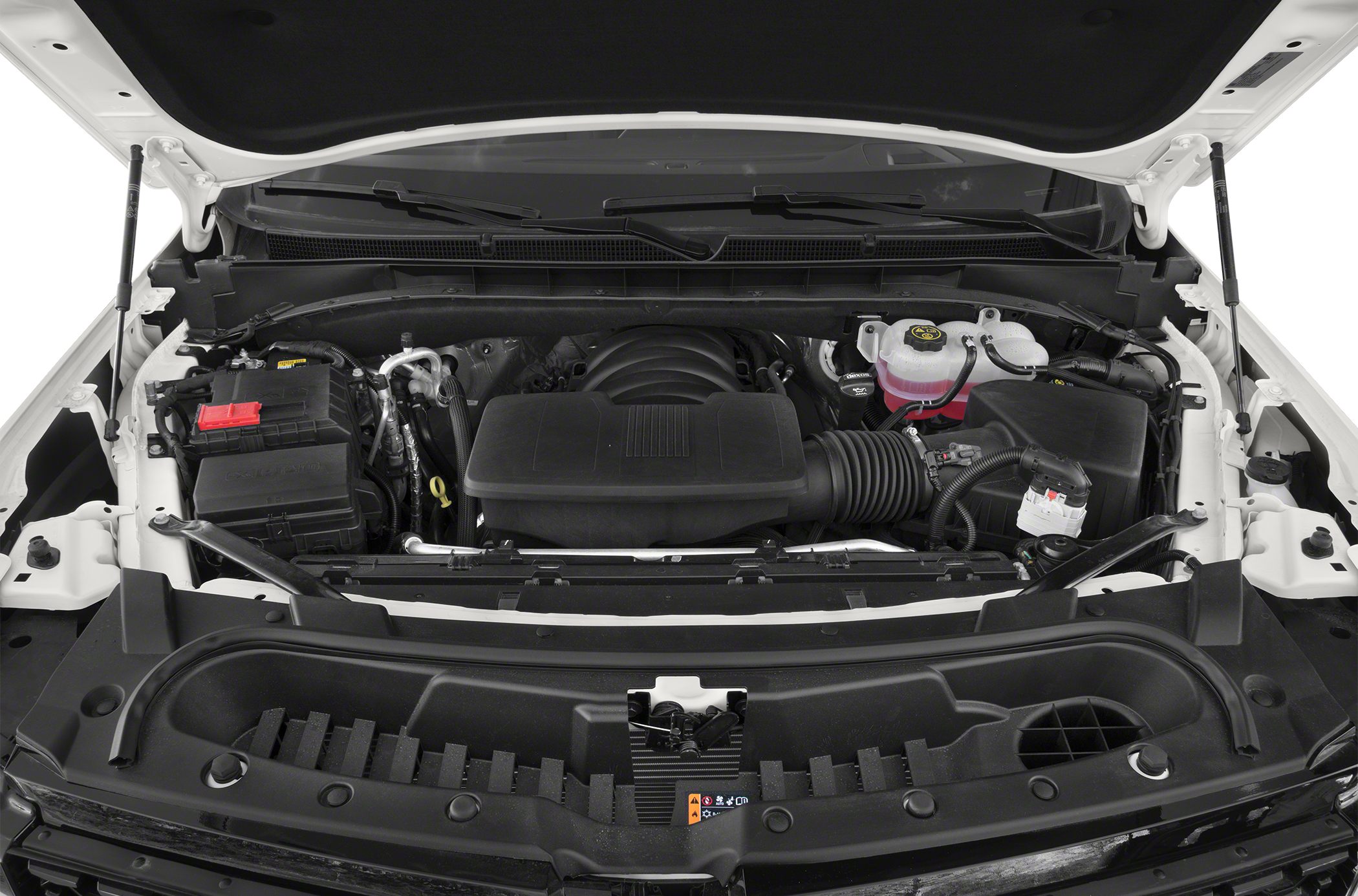 Organized and detailed SUV engine bay with air intake and fluid reservoirs