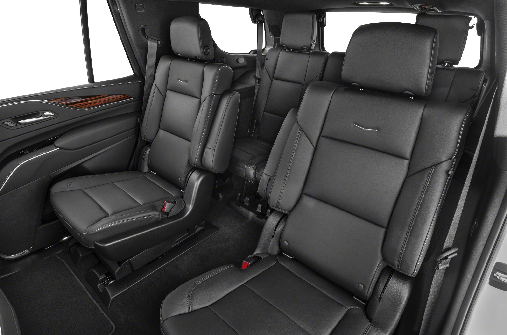 Black leather captain seats with wood trim and spacious SUV interior