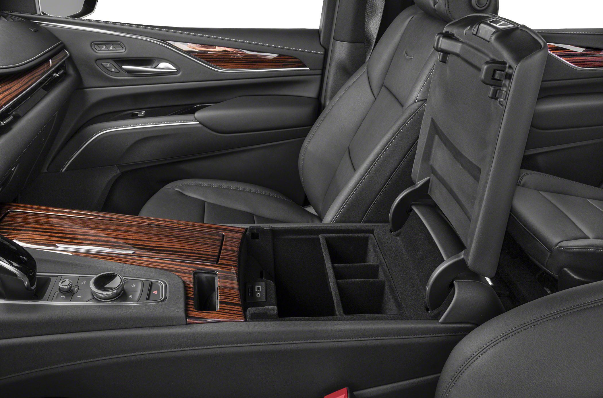 Premium leather seats and open center console with multiple compartments.