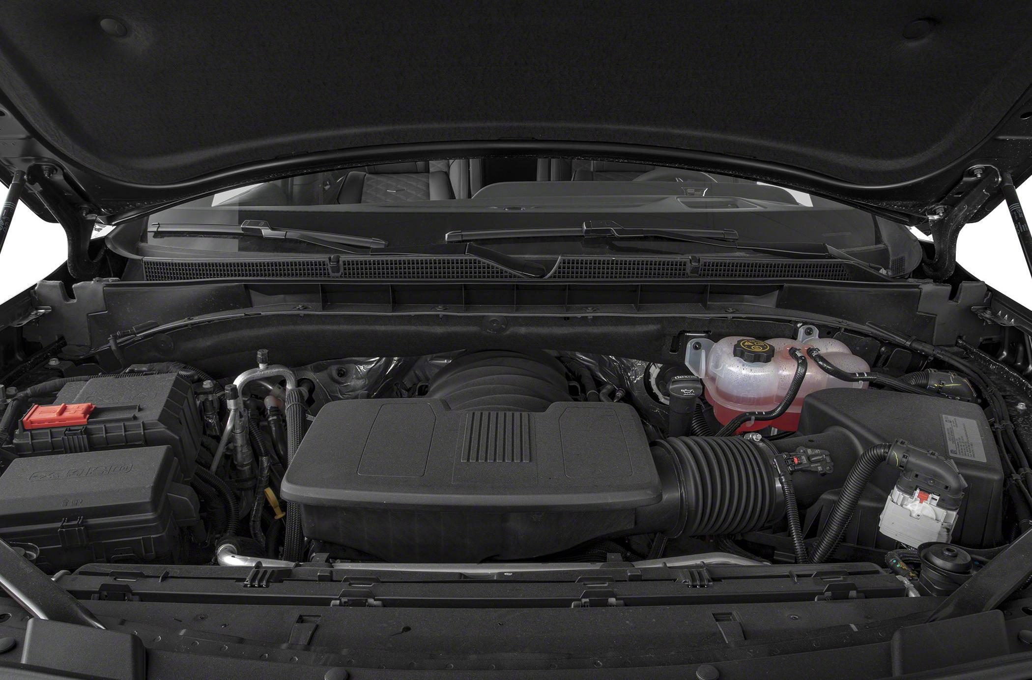 Engine compartment with air intake system and coolant reservoir