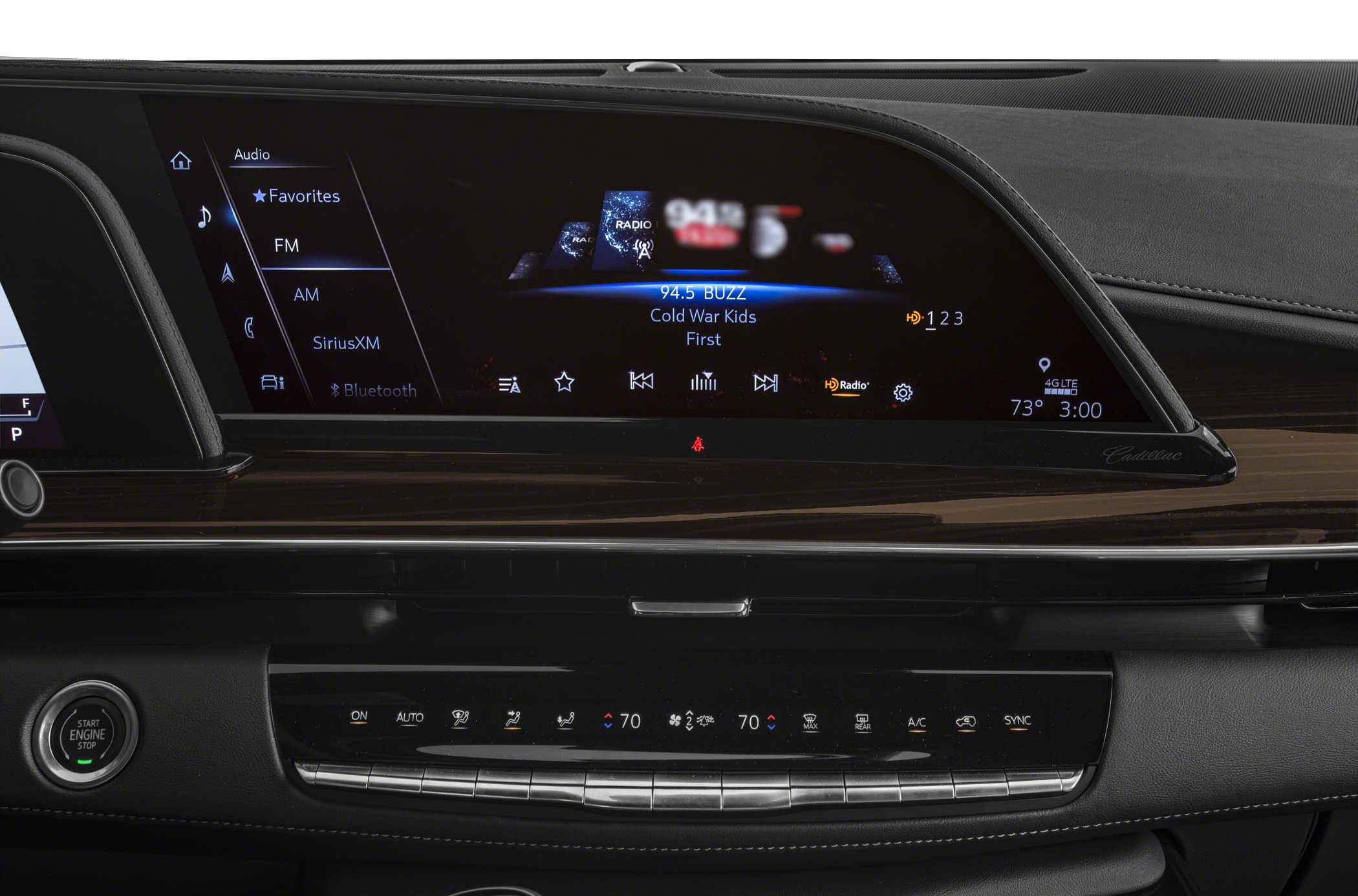 Infotainment touchscreen and digital climate controls with wood trim