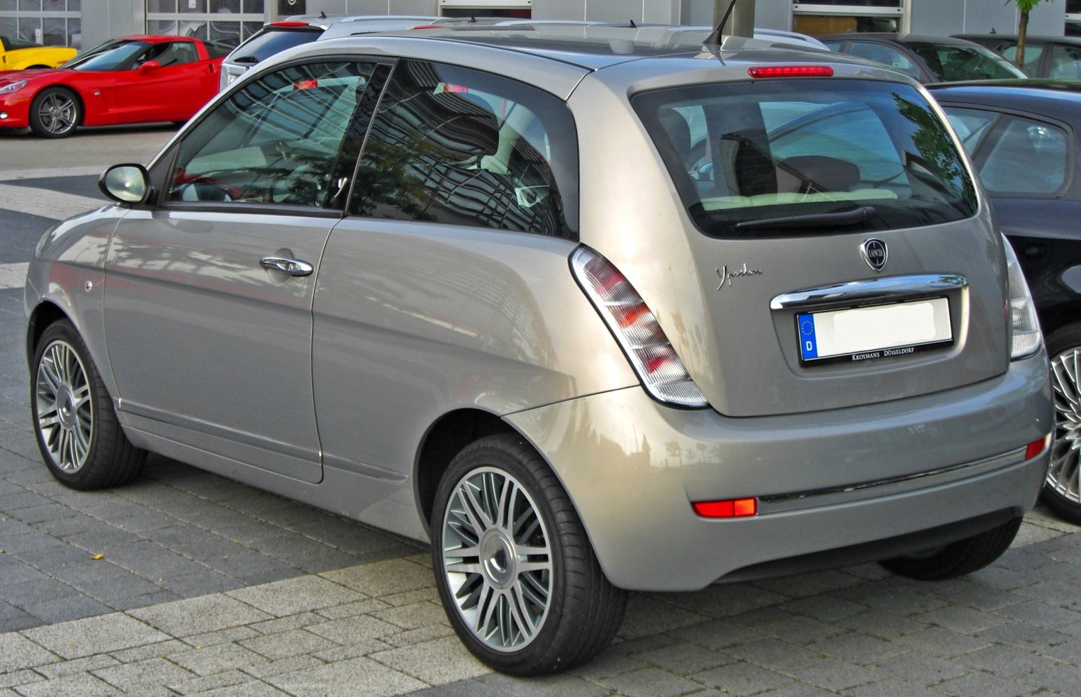 Compact hatchback rear with unique taillights and alloy wheels