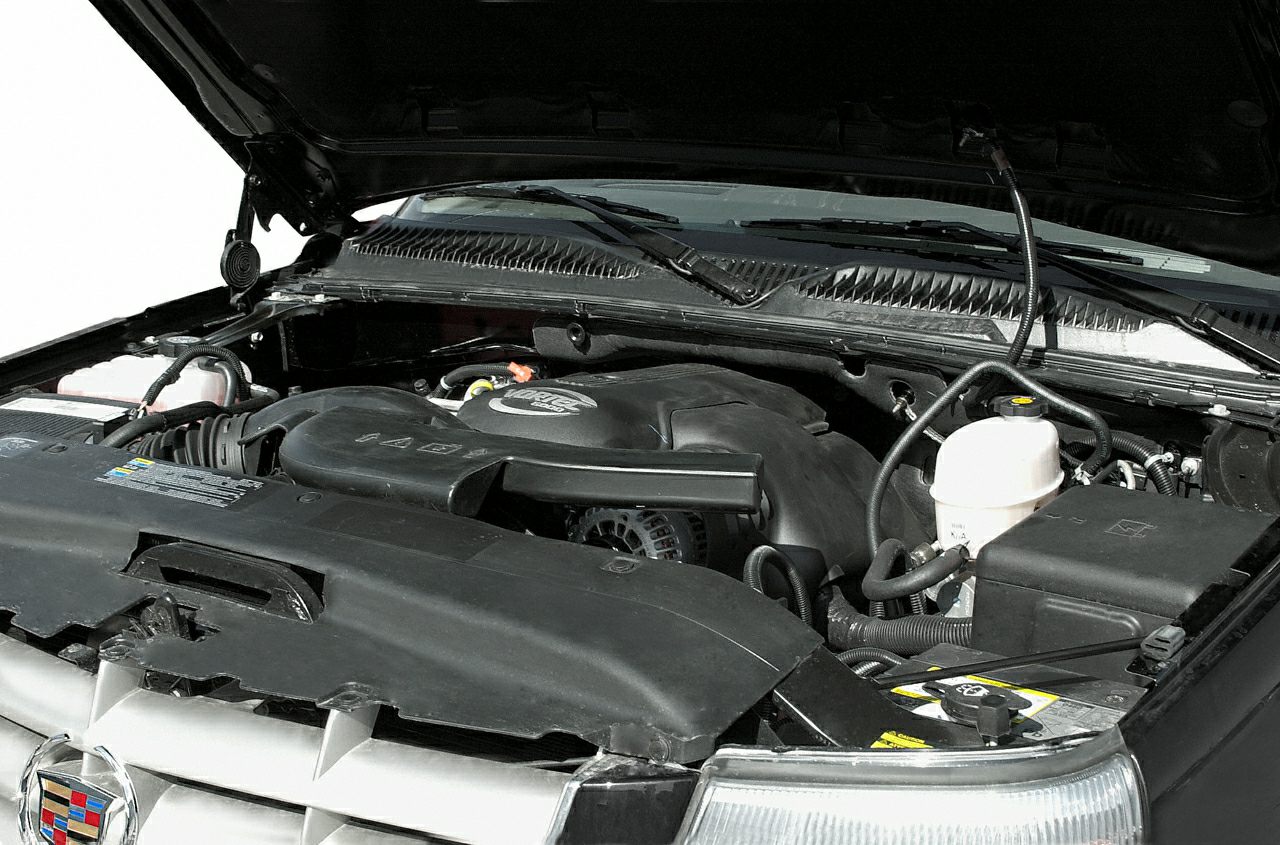 Engine bay with plastic covers and fluid reservoirs.