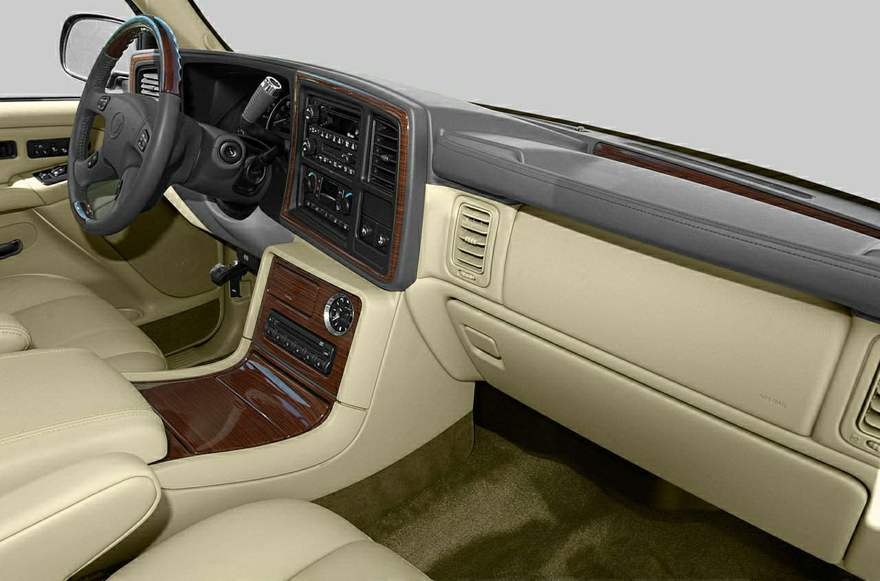 Luxury SUV interior with wood trim and beige leather seats