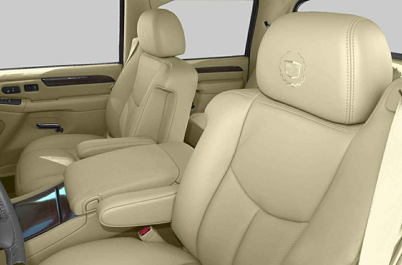 Beige leather seats with embroidered headrests and wood trim