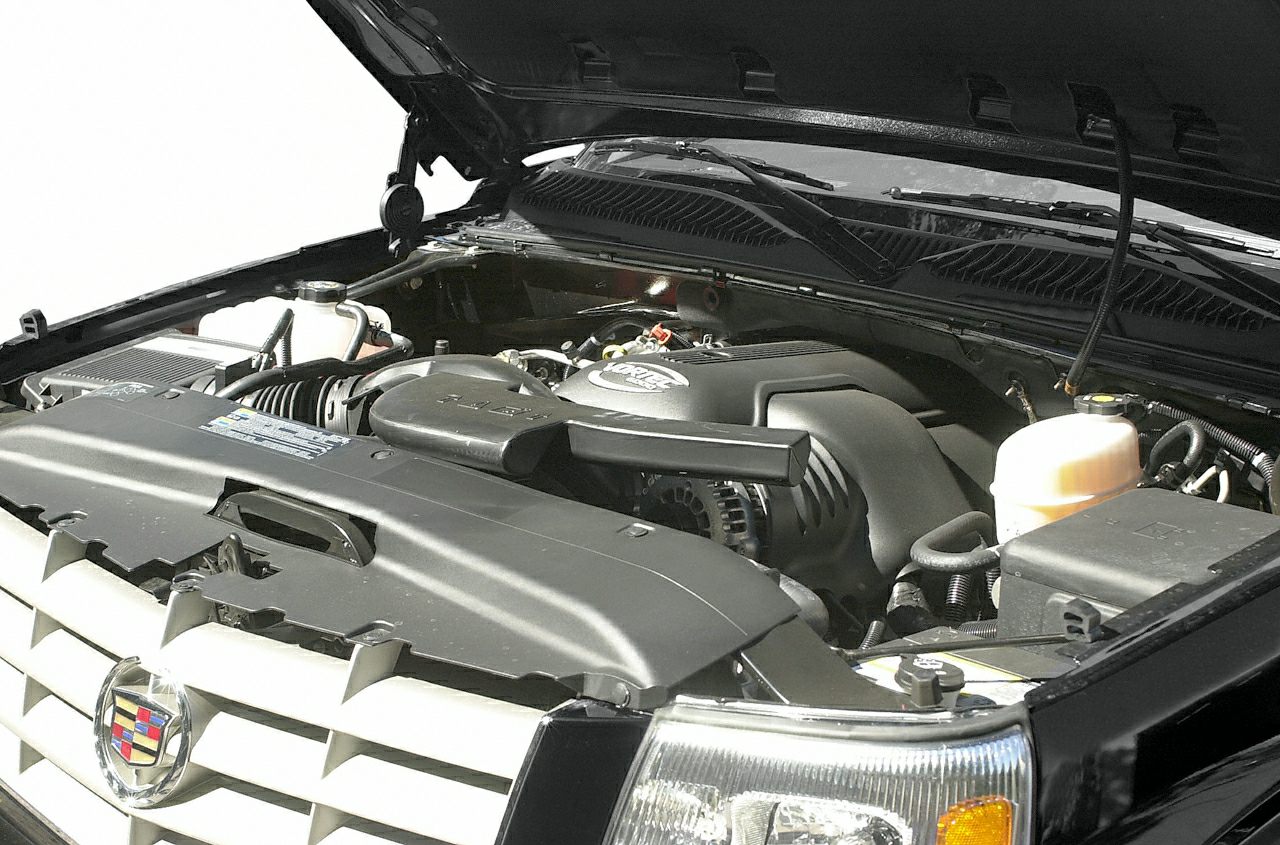 Close-up of engine bay with motor and components under hood