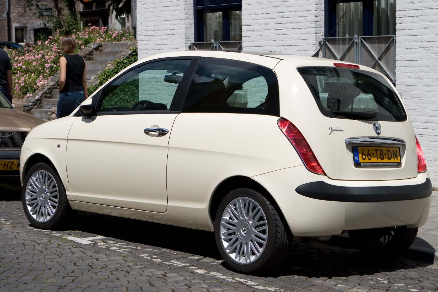 Compact hatchback rear-side with unique taillights and alloy wheels