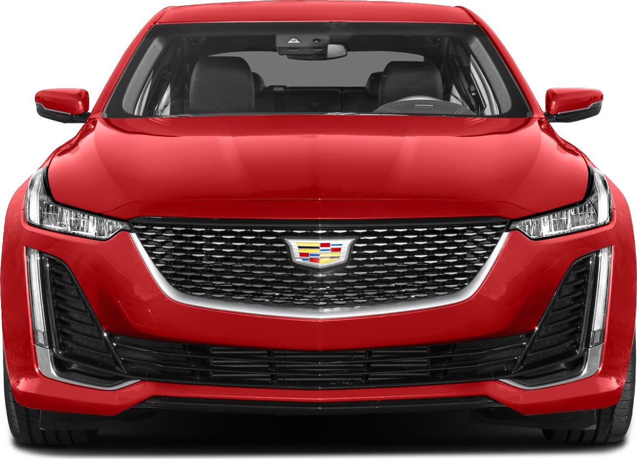 Bold grille and sleek LED headlights on a red sedan front view