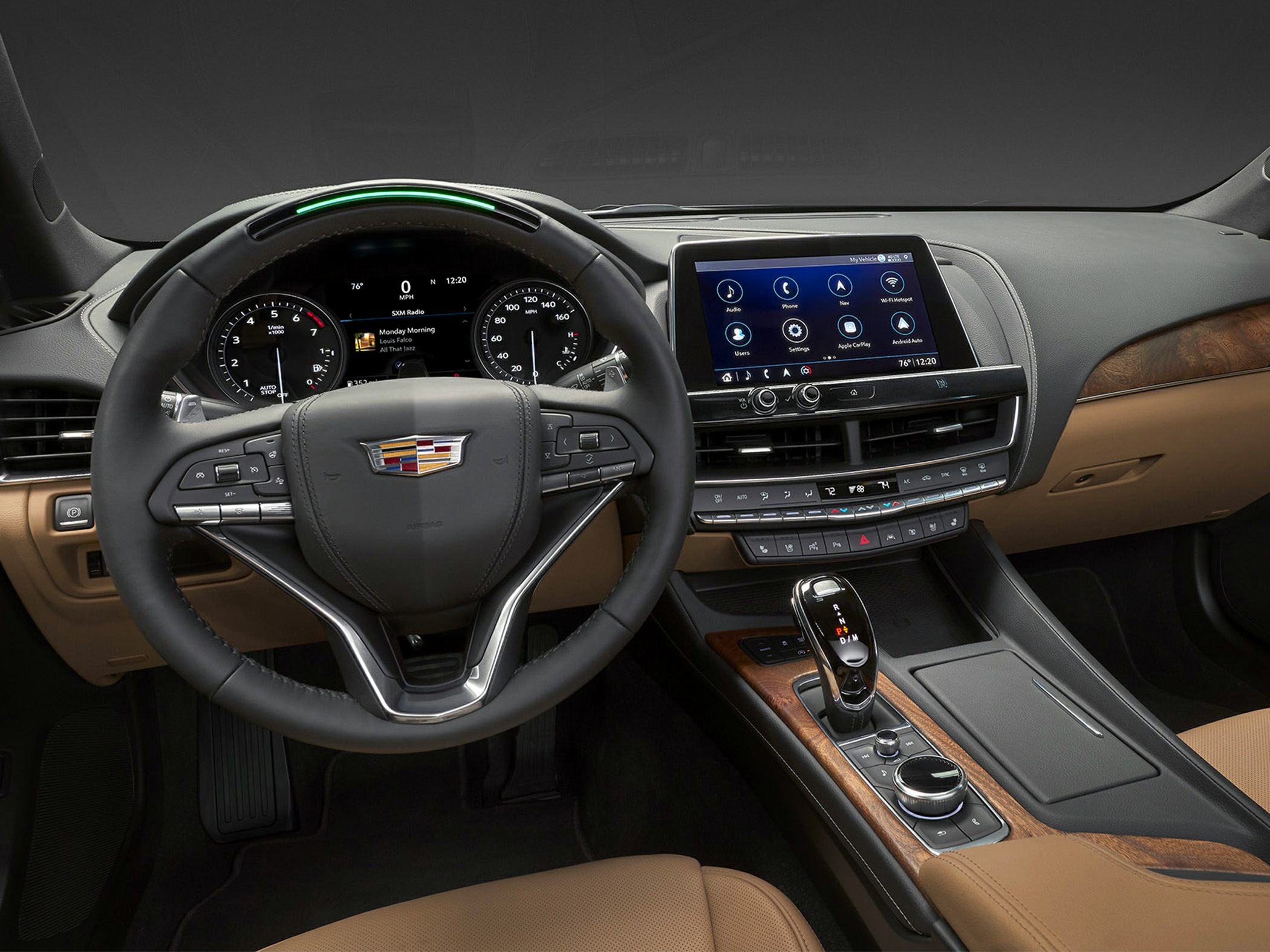 luxury car interior with touchscreen dashboard and leather steering wheel