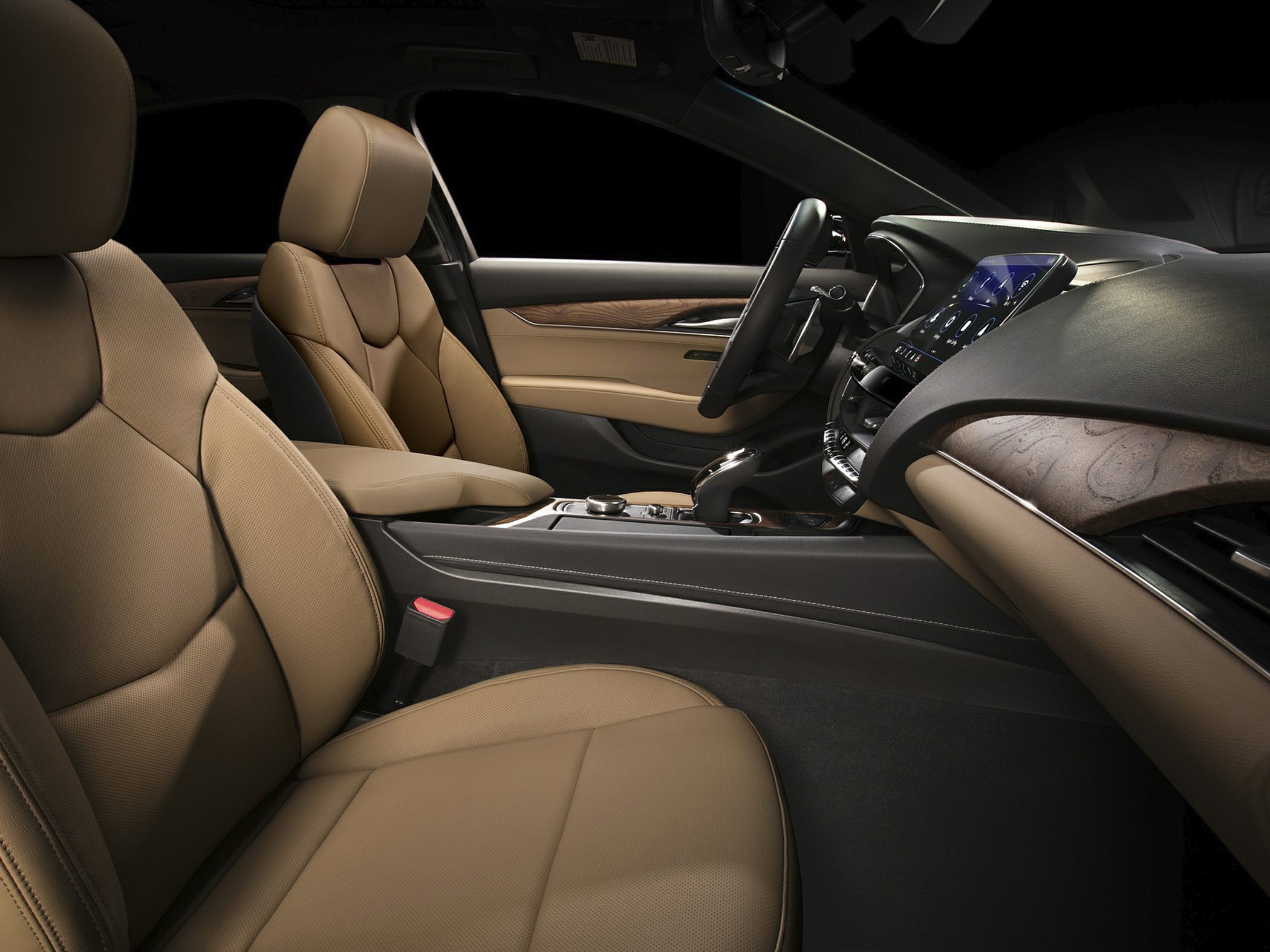 Tan leather seats and wood trim dashboard interior
