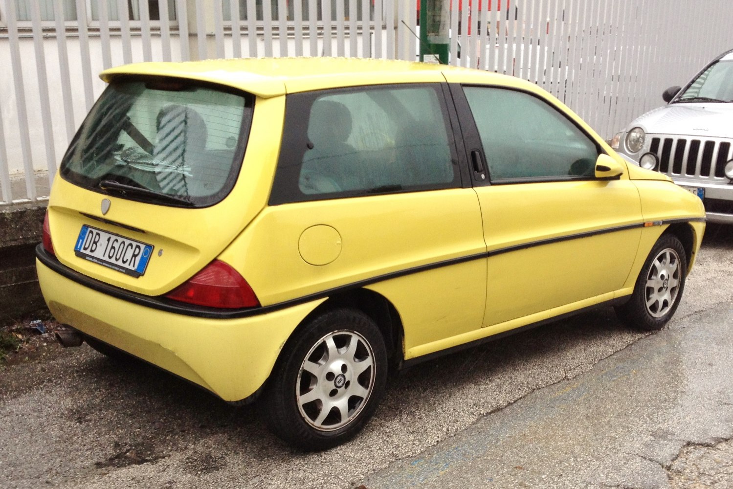 Compact hatchback with rounded rear and distinctive rear window design