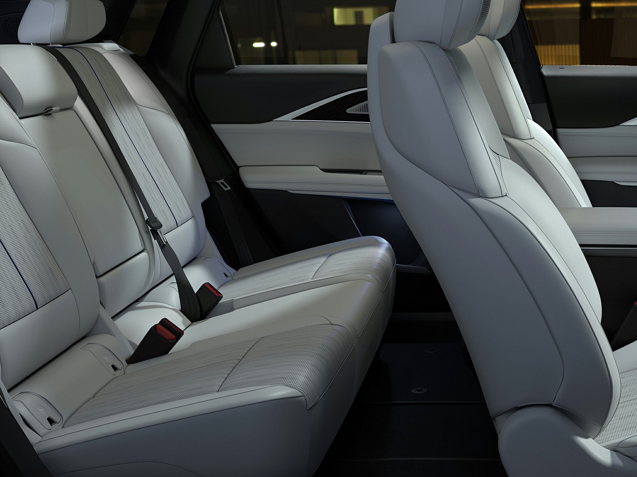 Premium light-colored rear leather seats with detailed stitching and elegant design.