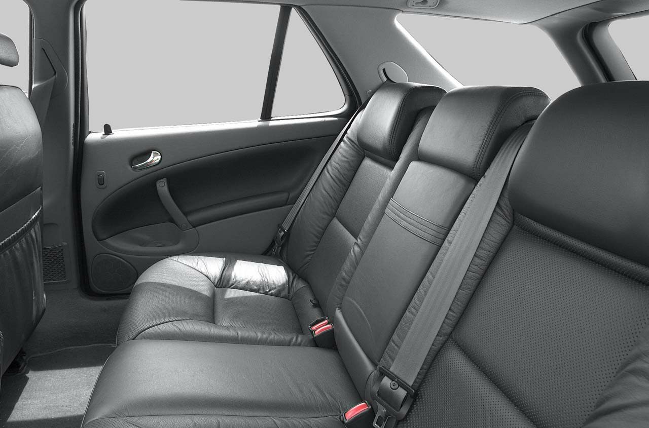 Rear leather seats and door panel with seatbelt in passenger compartment