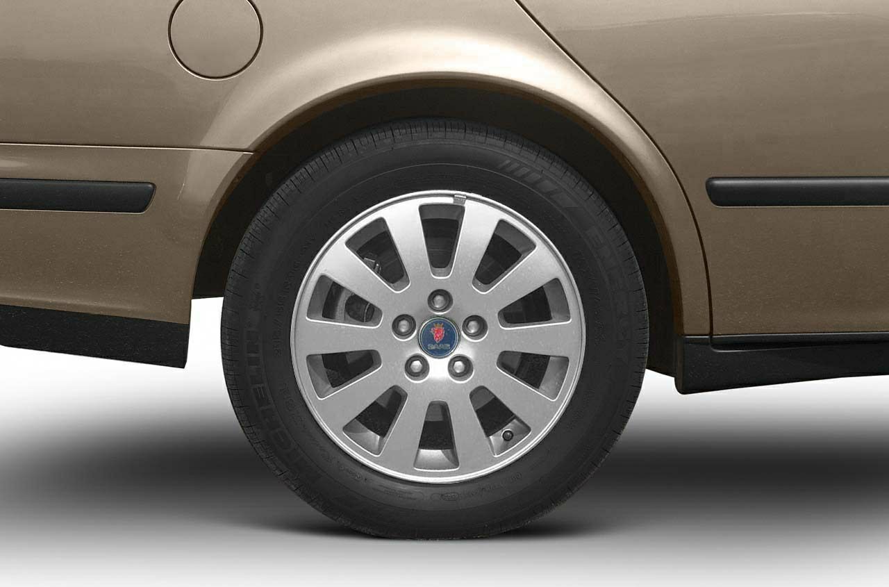 Close-up of alloy wheel and rear fuel cap on vehicle side