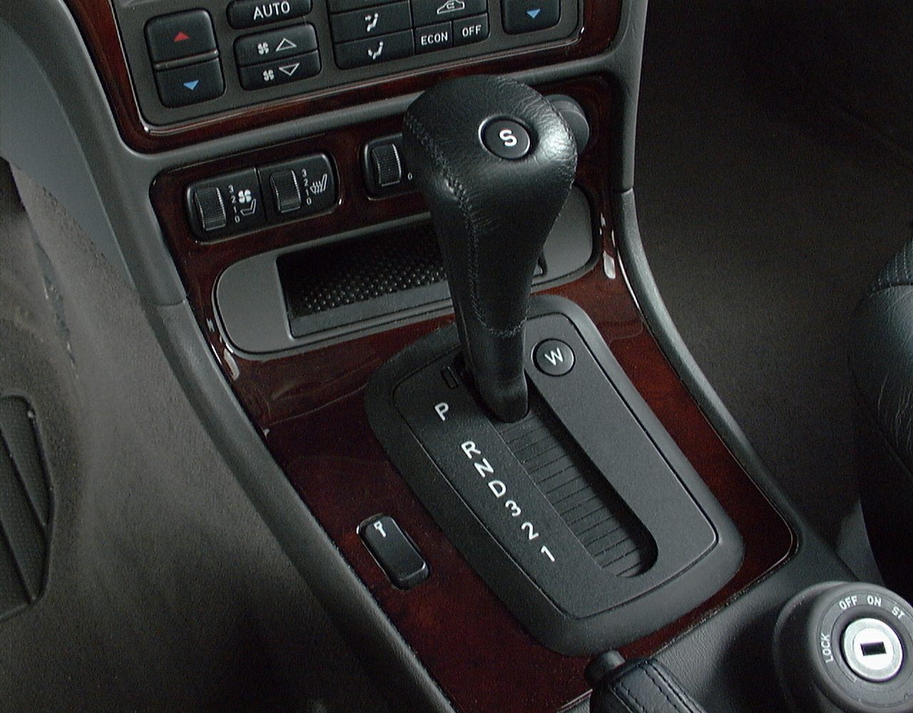 Automatic gear shift lever and climate control panel with wood trim interior