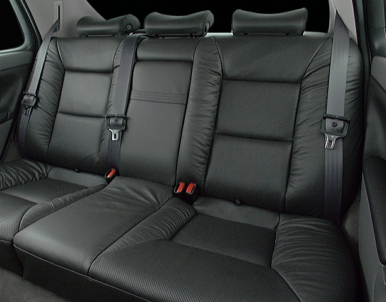Black leather rear seats with headrests and seatbelts