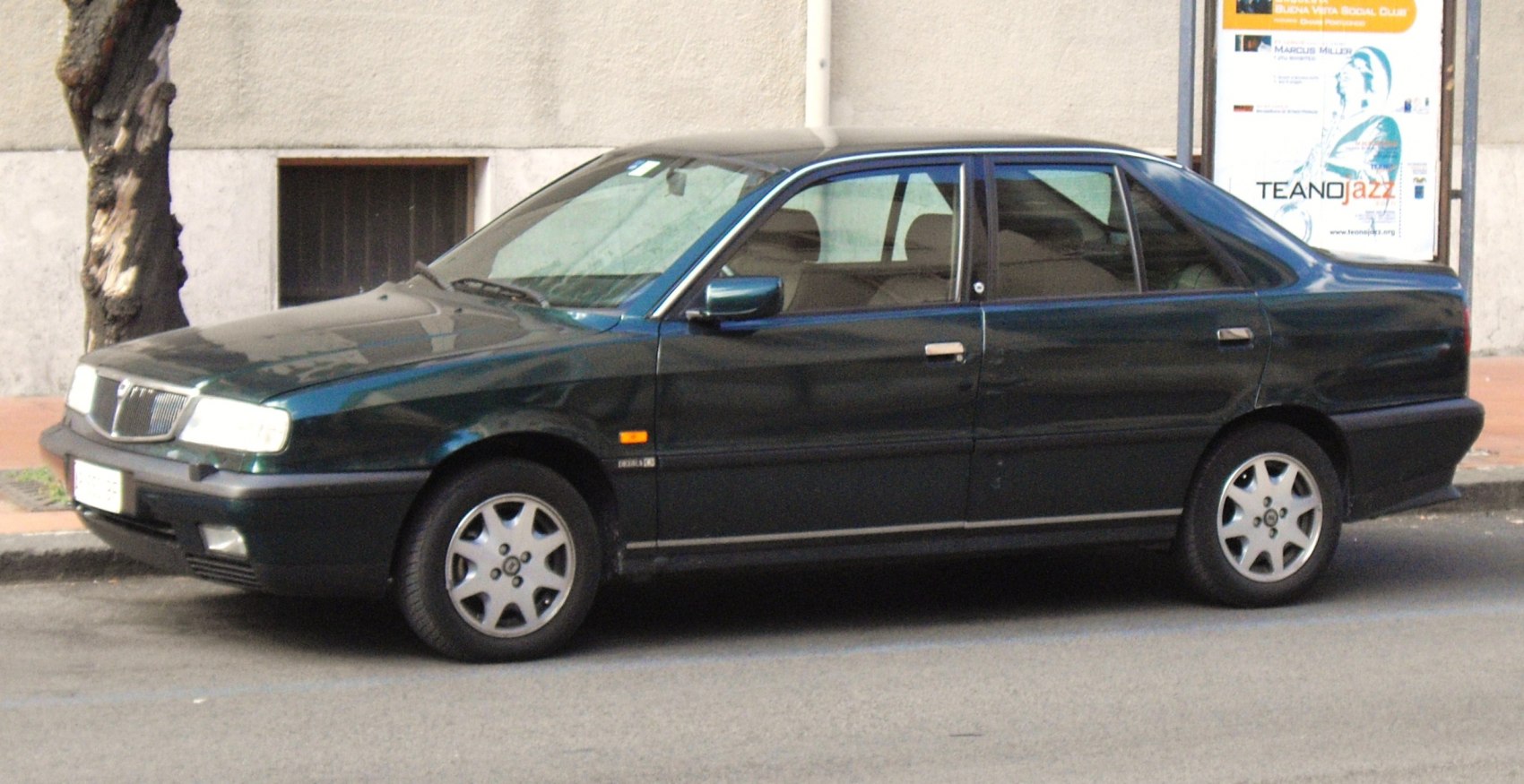 Classic sedan side profile with alloy wheels