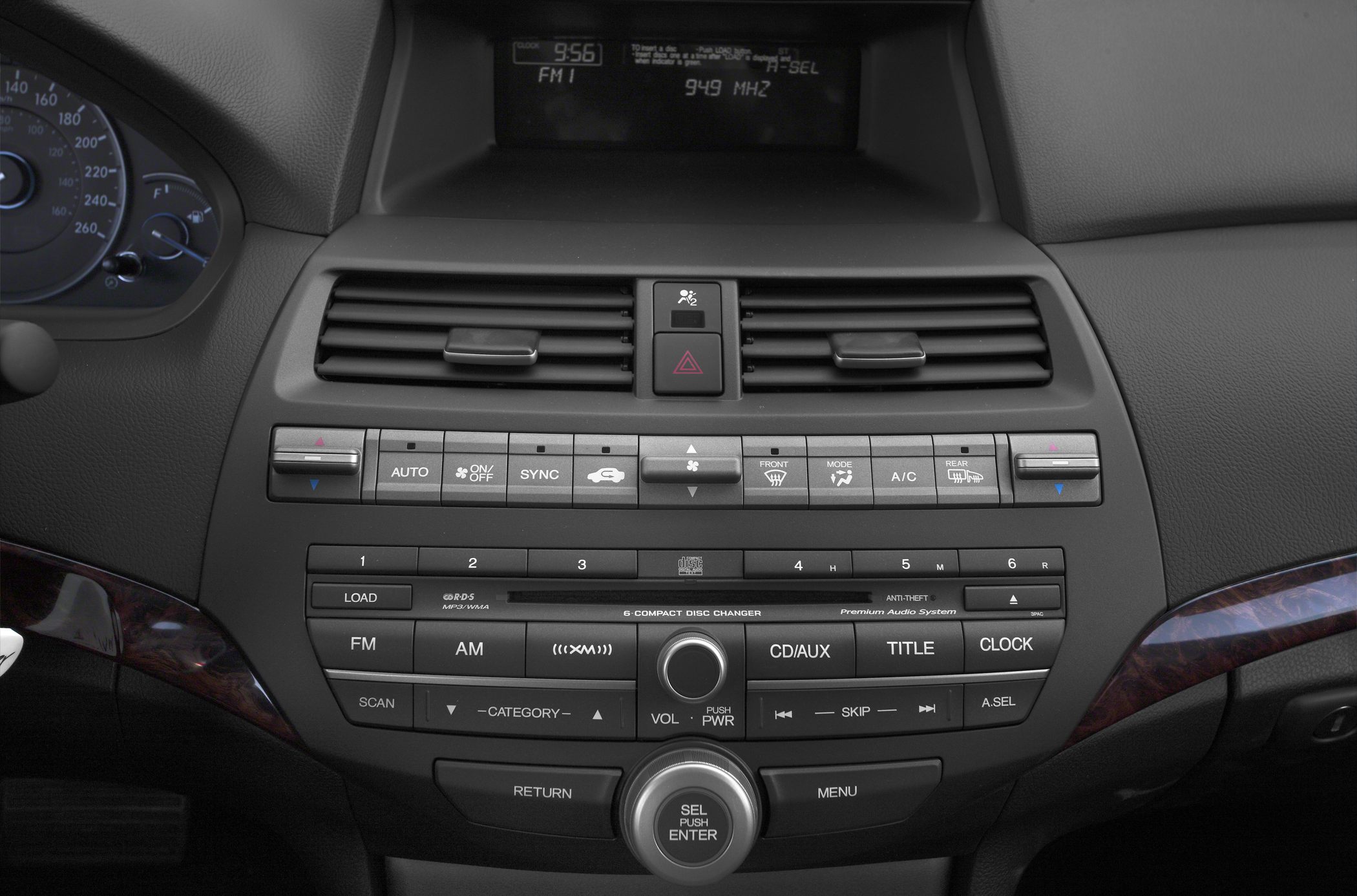 Dashboard center console with climate control and audio system panel.
