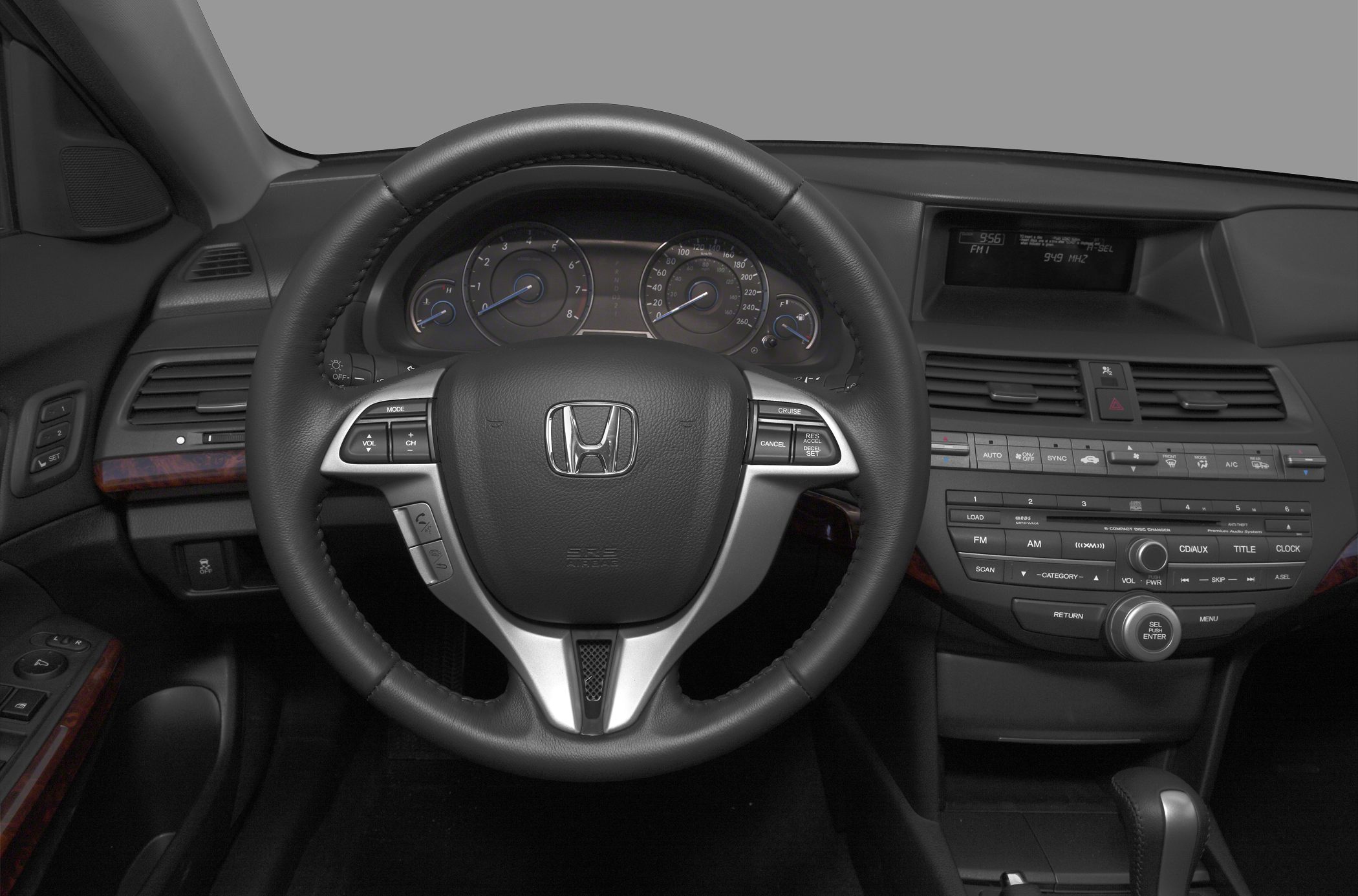 Steering wheel, instrument cluster, and dashboard controls in car interior