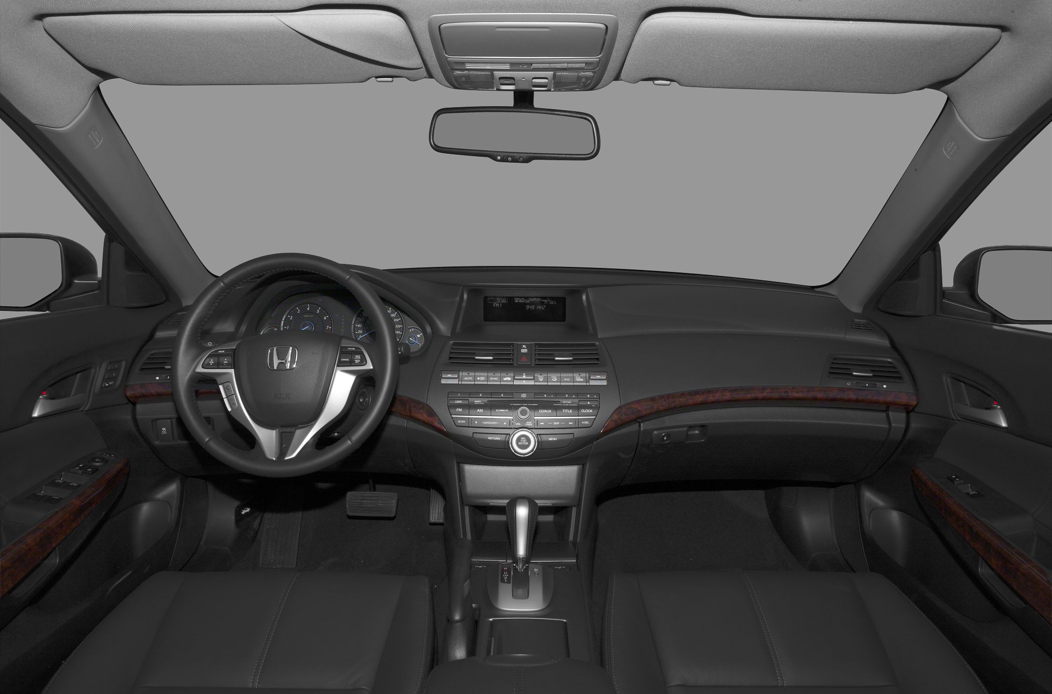 Dashboard and steering wheel with control panel and wooden trim details