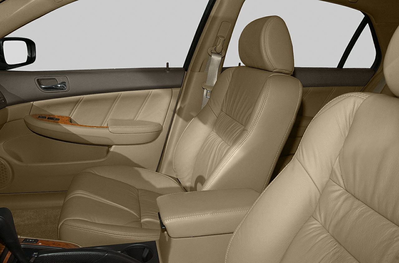 Beige leather front seats with wood trim door panel