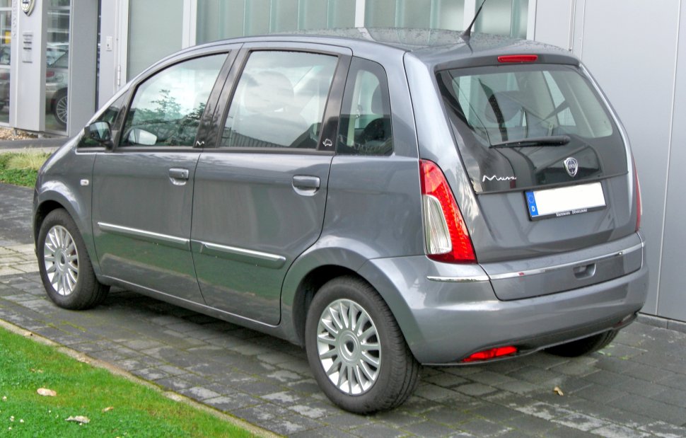 Rear and side view of a compact five-door vehicle with vertical taillights