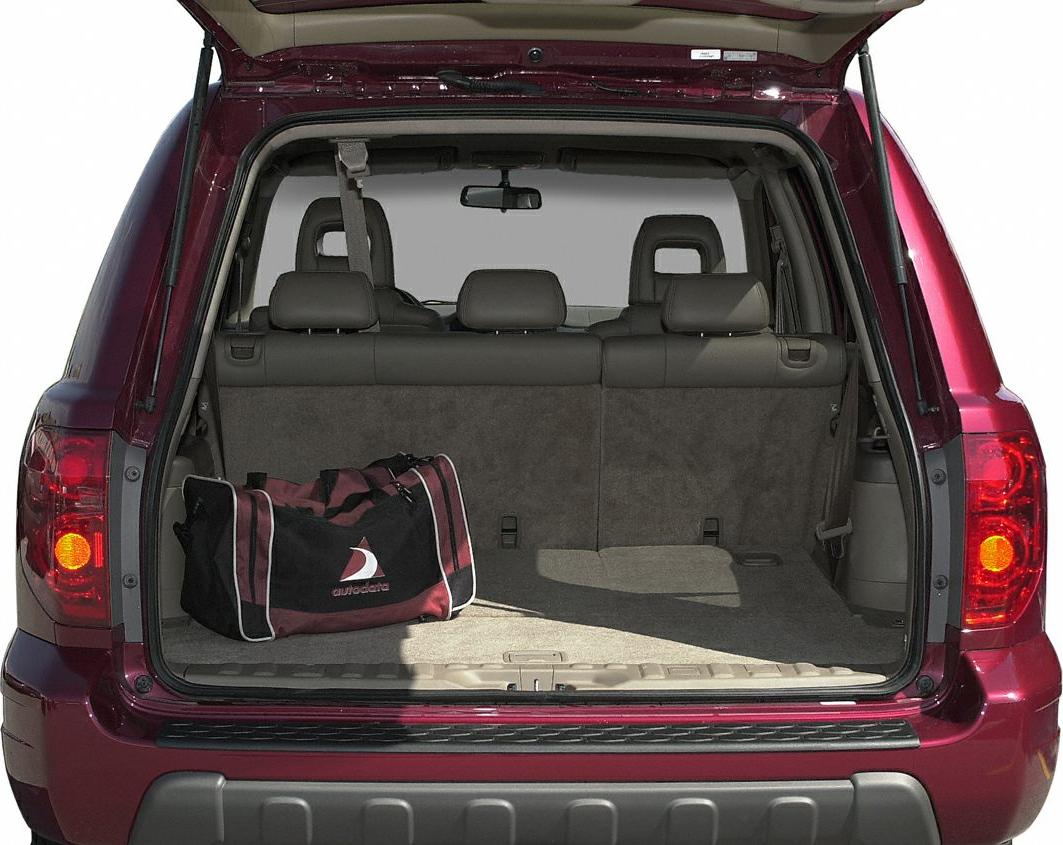 Open rear cargo space with foldable seats and single travel bag