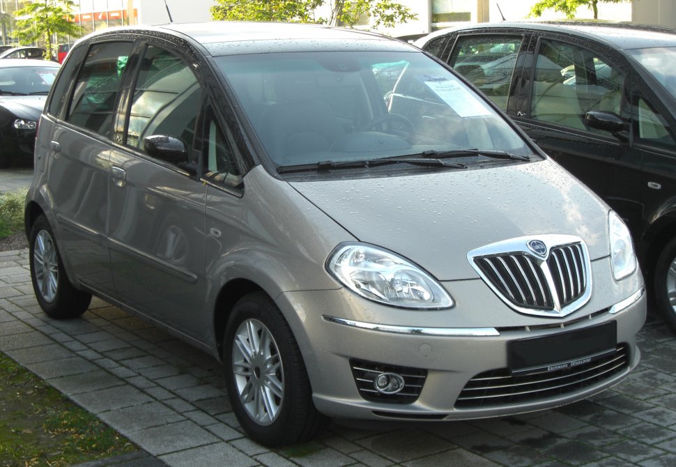 Front view with chrome grille and headlights