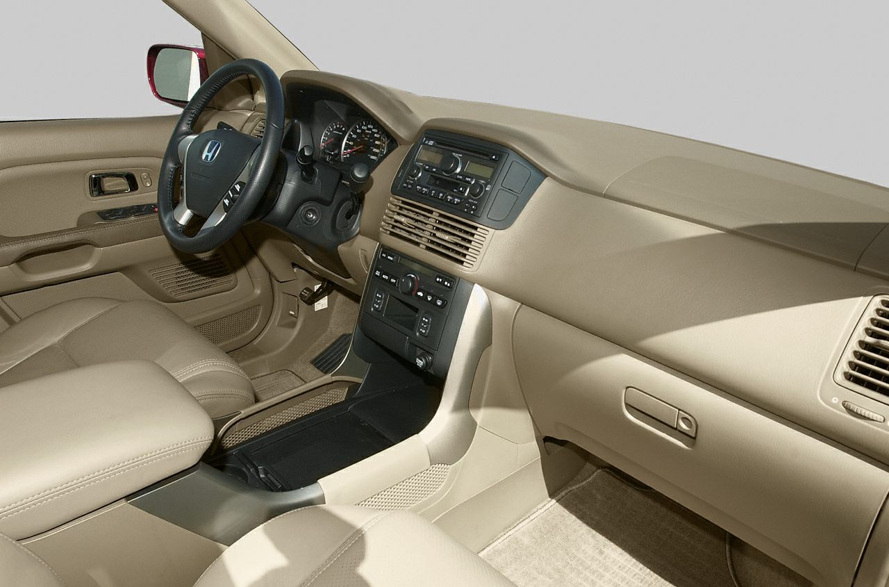 Beige interior dashboard and steering wheel with controls