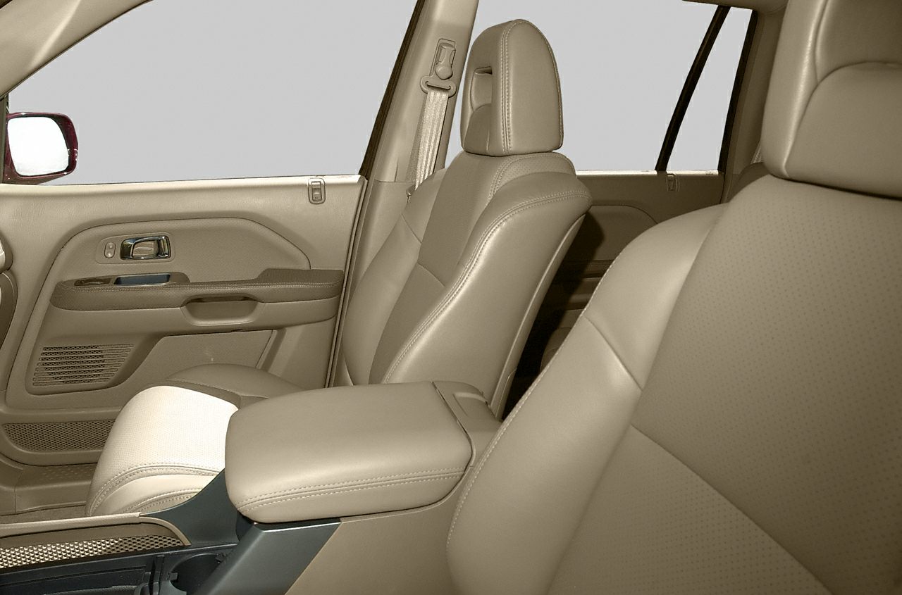 Beige leather front seats and detailed door panel interior