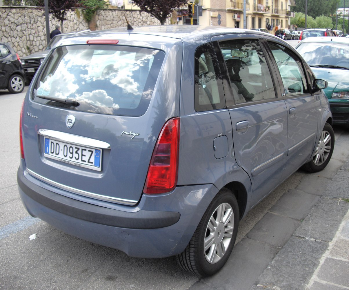 Compact tall hatchback rear and side view with vertical tail lights
