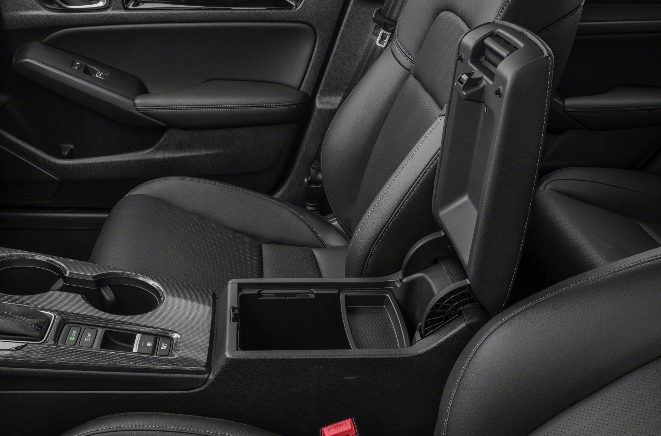 Center console with cup holders and open armrest storage compartment
