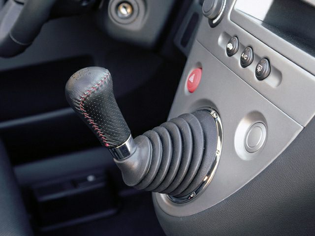 Manual gear shift lever with center console controls