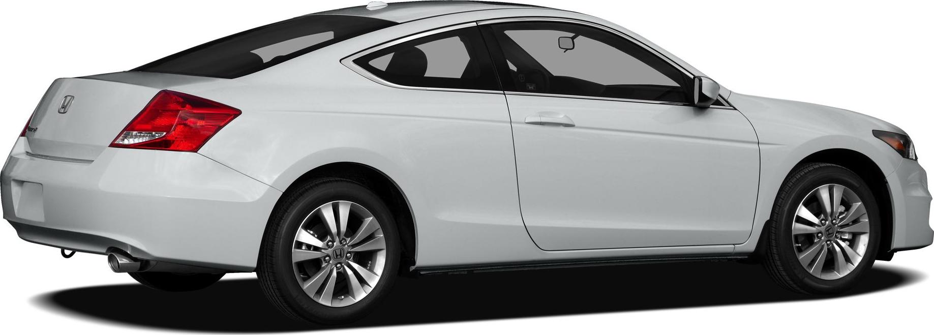 Side rear view of white coupe-style vehicle with alloy wheels