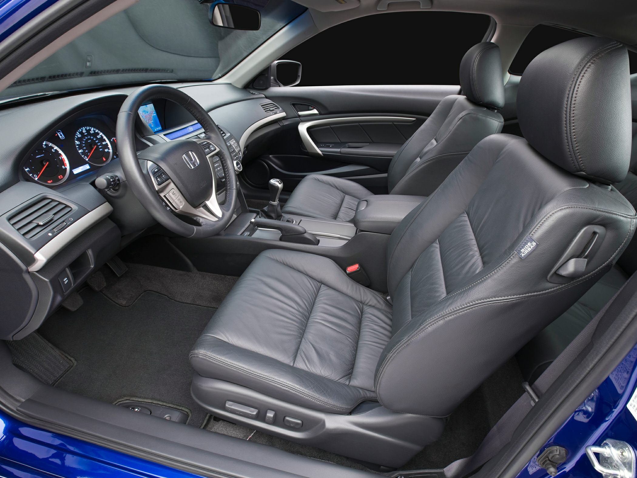 Leather seats and dashboard with manual gear shift