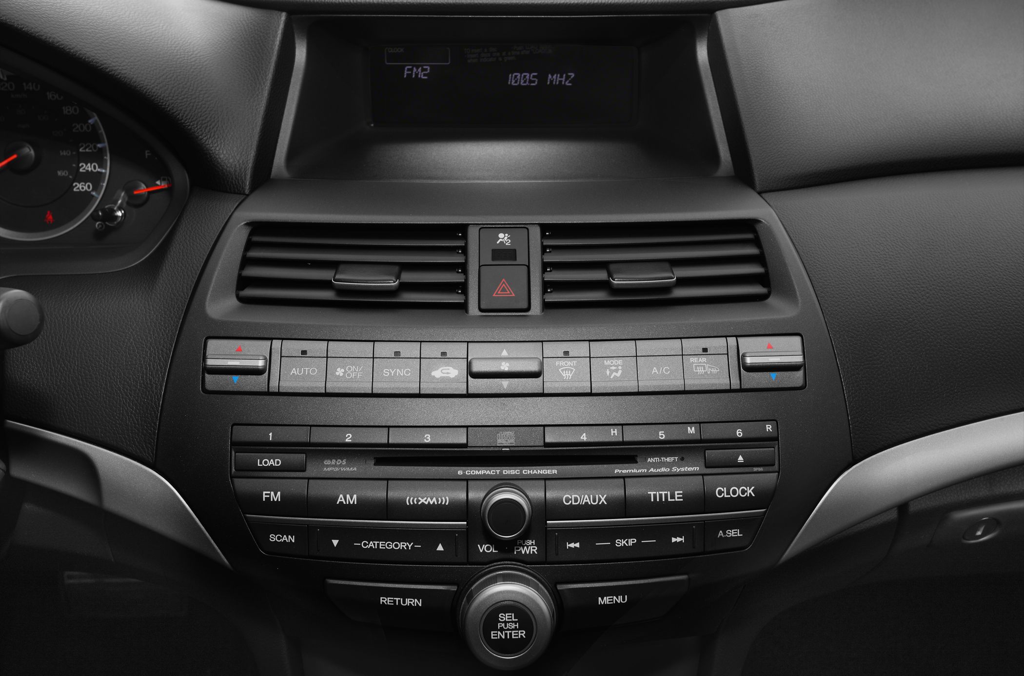 Center console with climate control and audio system in vehicle interior