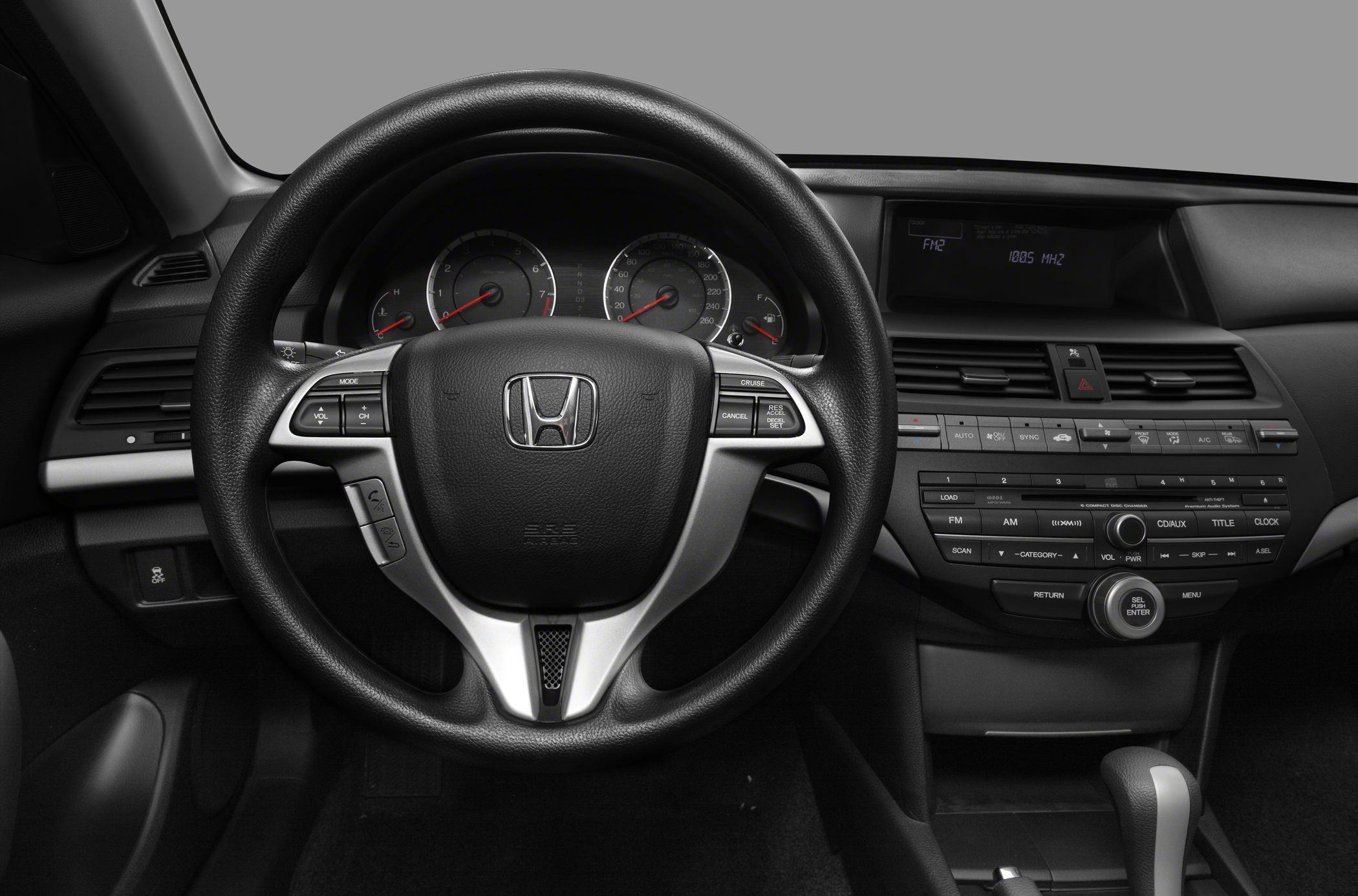 Steering wheel and dashboard with controls and instrument panel